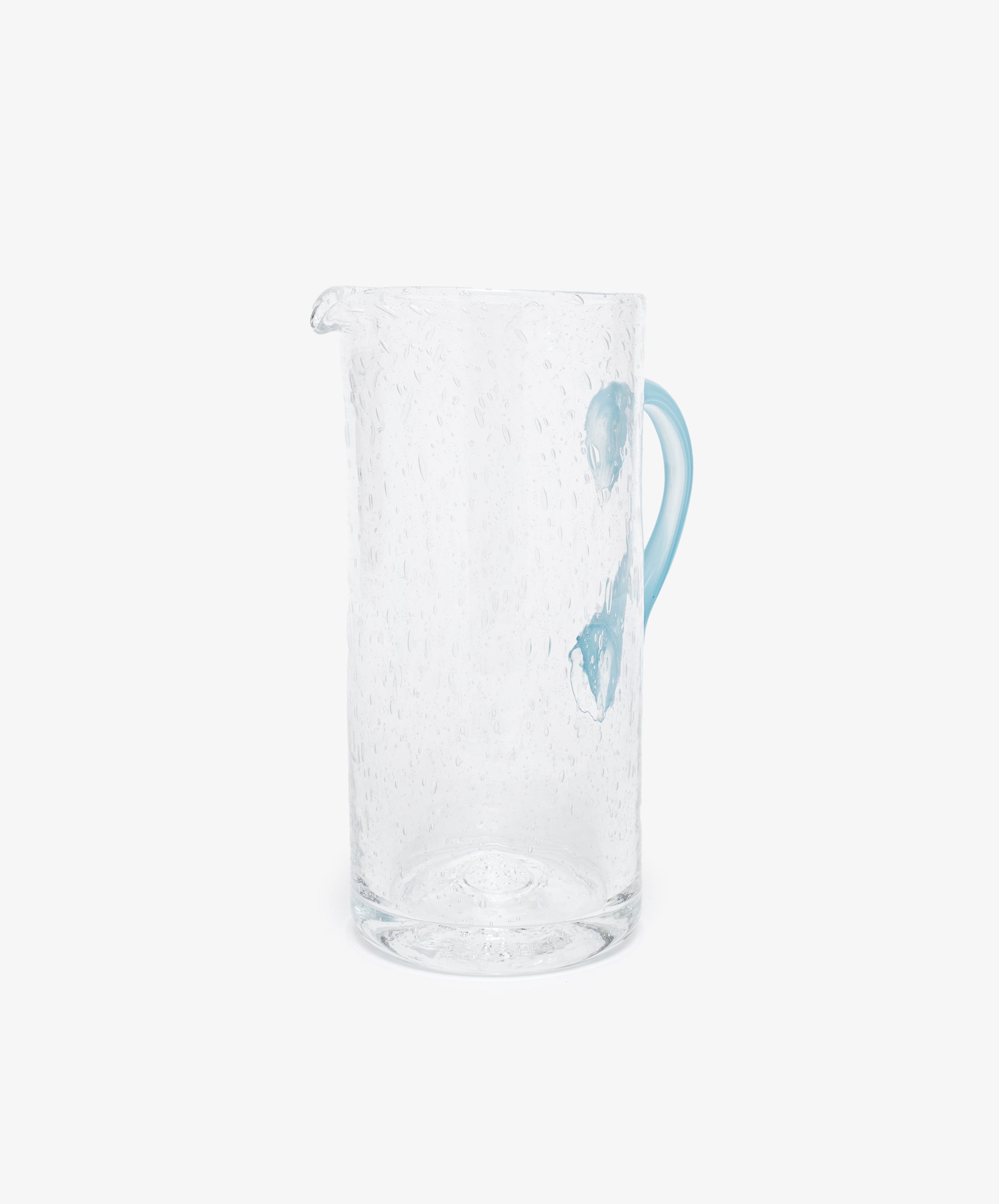 Pauline Jug by La Romaine Editions. Hand-blown clear glass pitcher with light blue handle, alt side view.