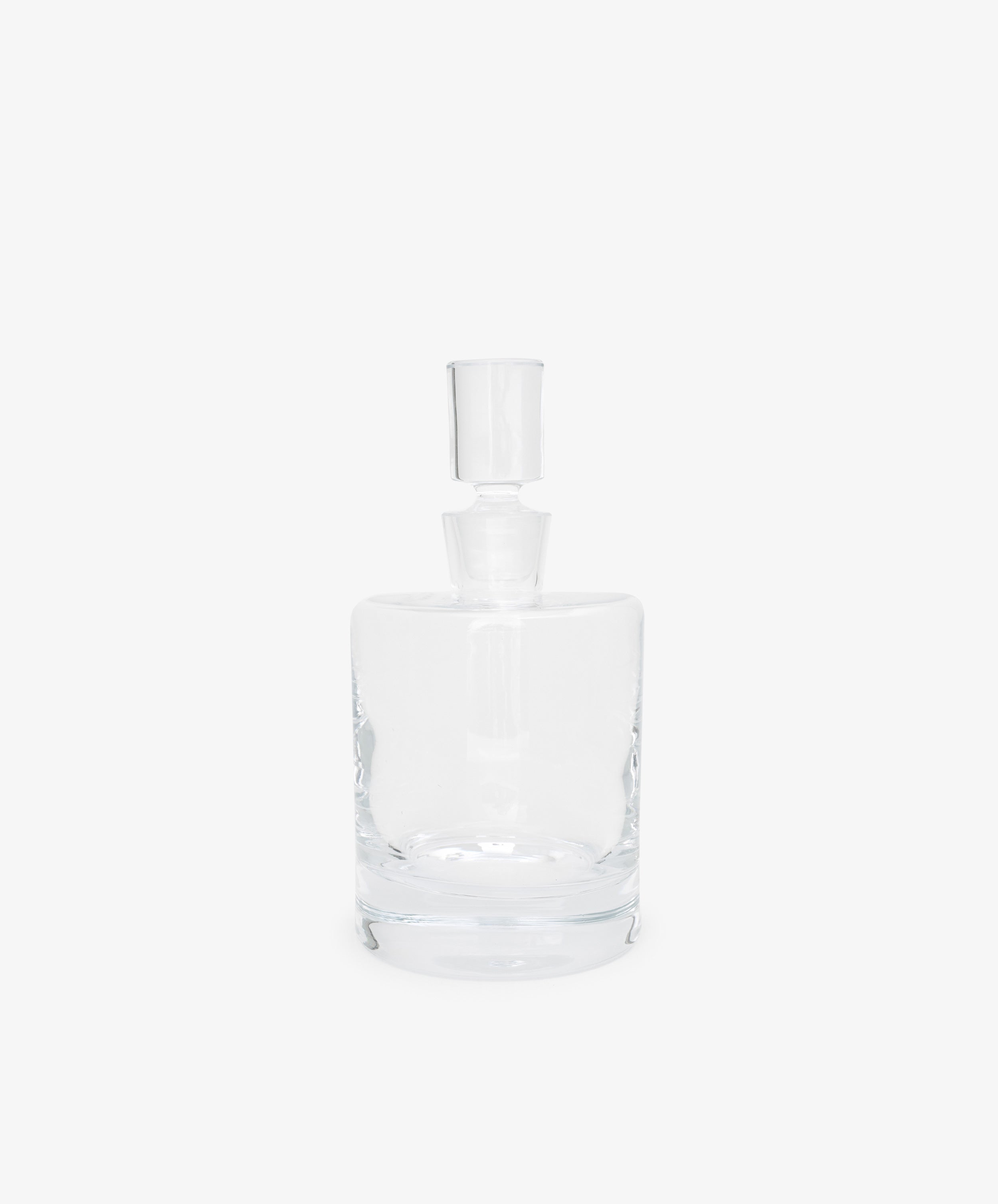 The Boris Decanter features clear glass with an architectural profile and a matching cylindrical stopper, shown against a plain white background.