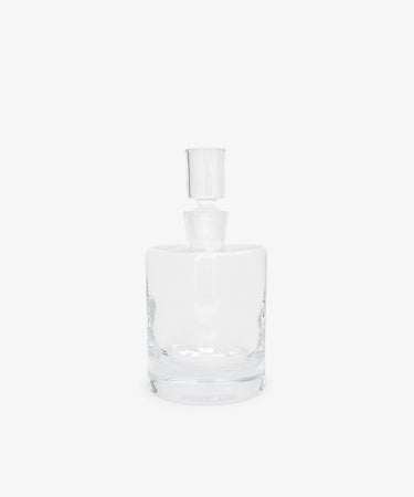 The Boris Decanter features clear glass with an architectural profile and a matching cylindrical stopper, shown against a plain white background.