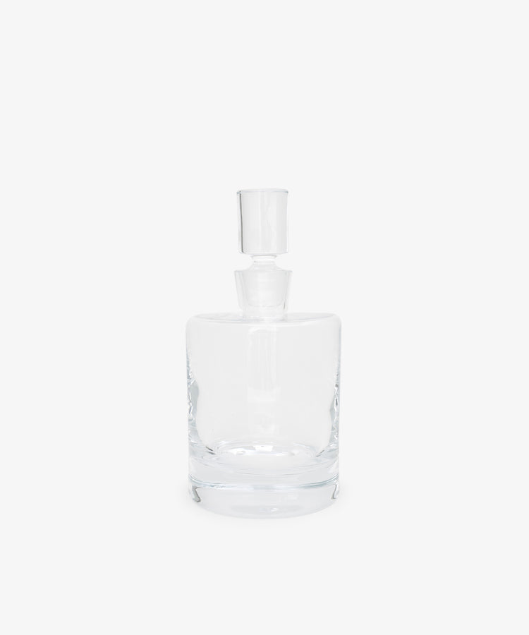 The Boris Decanter features clear glass with an architectural profile and a matching cylindrical stopper, shown against a plain white background.