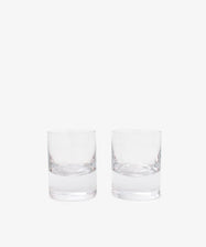 The Boris Tumbler, Set of 2, features clear, empty whisky glasses with weighted bases placed side by side against a plain white background.