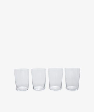 Teo Ridged Tumbler. Row of four of clear ribbed taller glasses. 