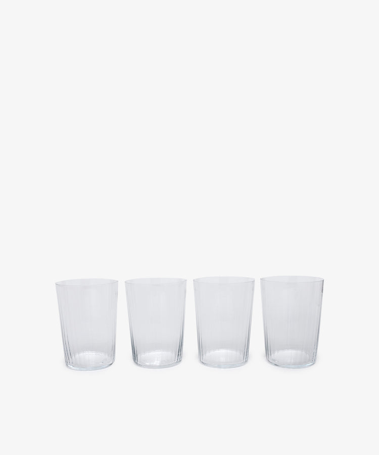 Teo Ridged Tumbler. Row of four of clear ribbed taller glasses. 