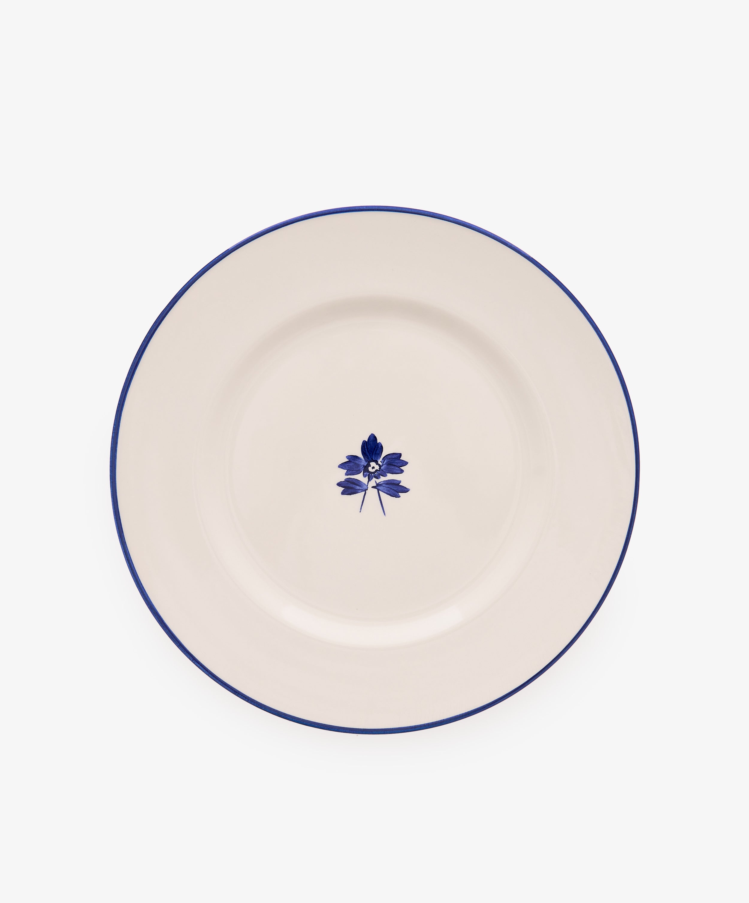 Beatrix Dinner Plate, Set of 4 features white ceramic with a thin blue rim and central blue floral design, shown on a plain white background.