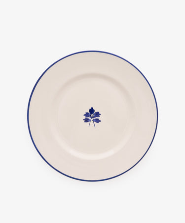Beatrix Dinner Plate, Set of 4 features white ceramic with a thin blue rim and central blue floral design, shown on a plain white background.