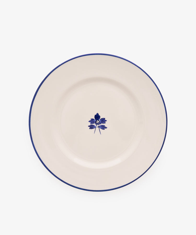Beatrix Dinner Plate, Set of 4 features white ceramic with a thin blue rim and central blue floral design, shown on a plain white background.