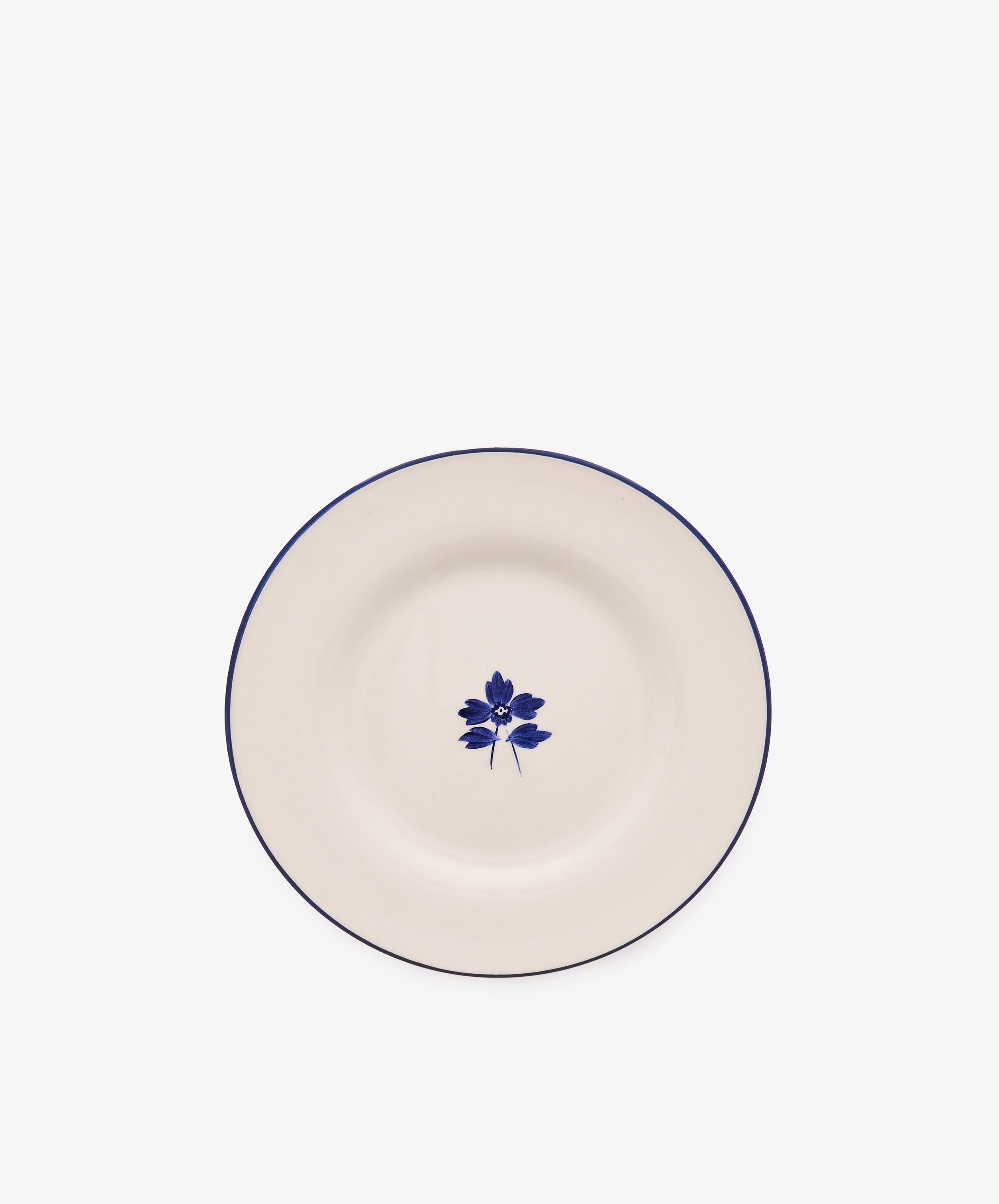 Beatrix Salad Plate, Set of 4—a white ceramic plate with a thin blue rim and botanical flower design, inspired by classic English blue-and-white china.