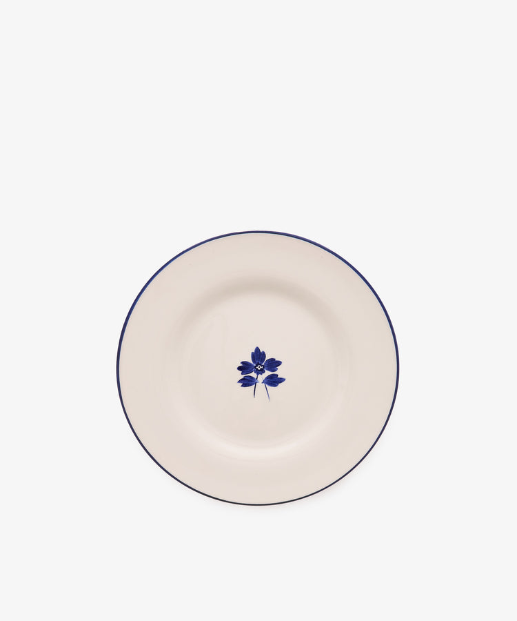 Beatrix Salad Plate, Set of 4—a white ceramic plate with a thin blue rim and botanical flower design, inspired by classic English blue-and-white china.
