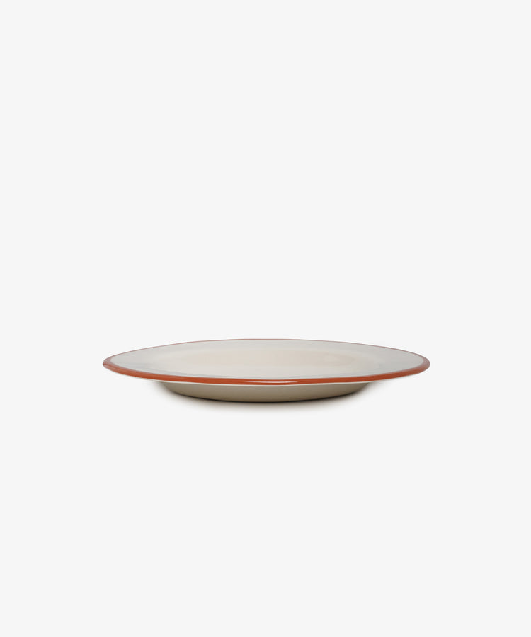 The Un oeuf is un oeuf plate is a round, off-white ceramic dish with a slim brown rim, showcased on a white background—an elegant stoneware piece.