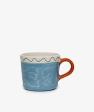 Colombe Mug. Light blue painted stoneware mug with dove illustrations and orange handle, back side view.