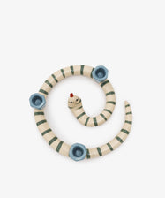 Sneaky Stripe Candle Holder by Laetitia Rouget. Glazed ceramic spiral striped snake with 3 candle slots, overhead view.