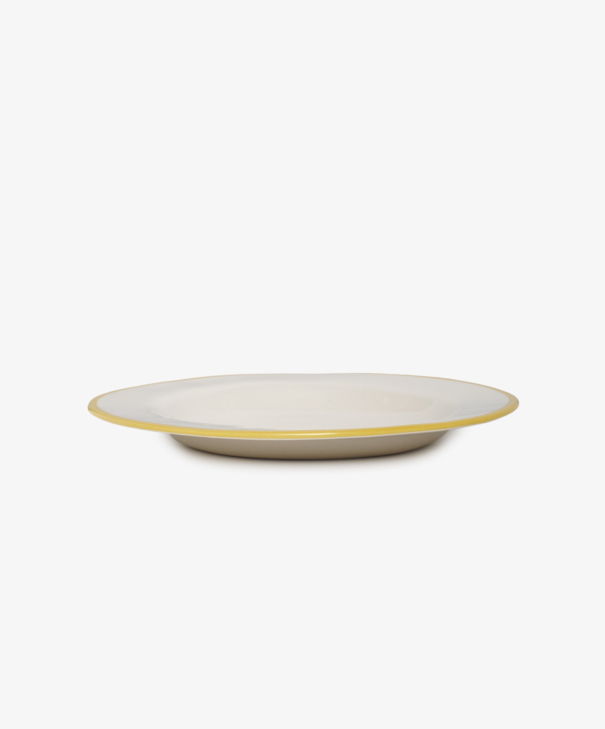 Honey, you're the bees knees white stoneware plate, angled side view.