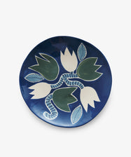 Indigo Tulip Fruit Platter by Laetitia Rouget. Blue glazed ceramic plate with floral motif in green and white.