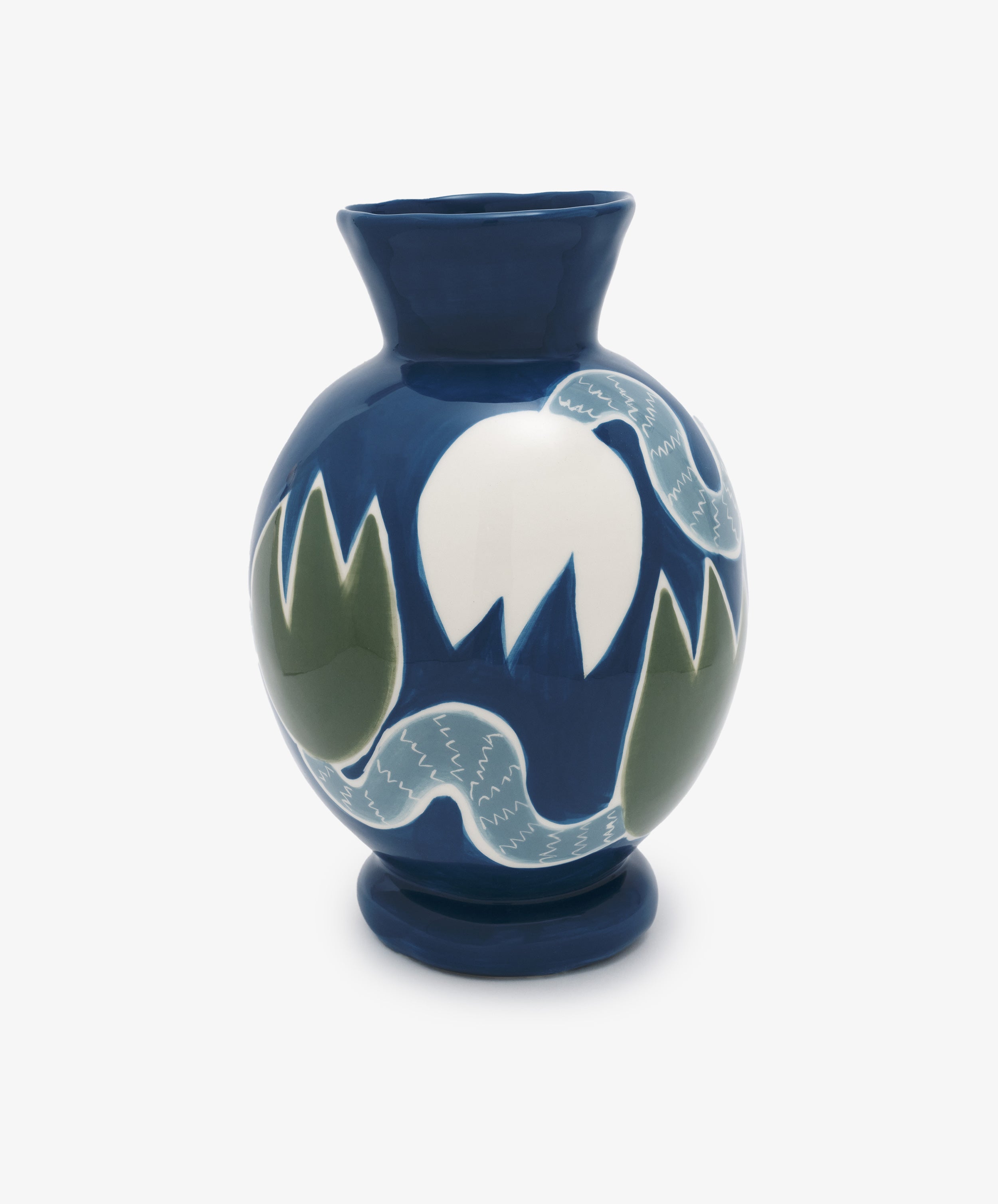 Tulip Flower Vase by Laetitia Rouget. Glazed ceramic vessel in indigo with white and green illustrated flowers.