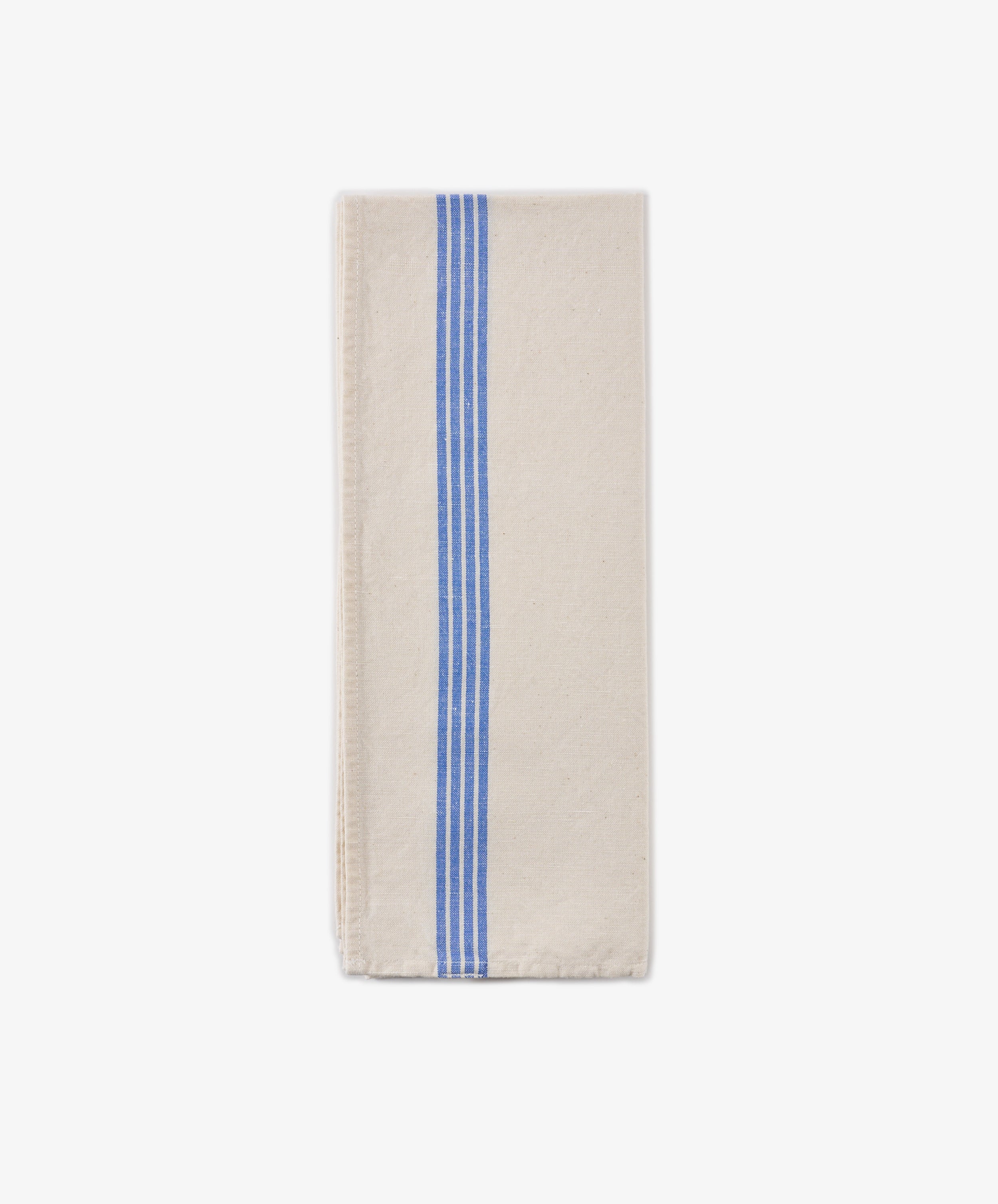 The Métis Tea Towel, crafted from a folded beige linen-cotton blend and adorned with three parallel blue stripes running vertically along one side, is displayed on a plain white background.