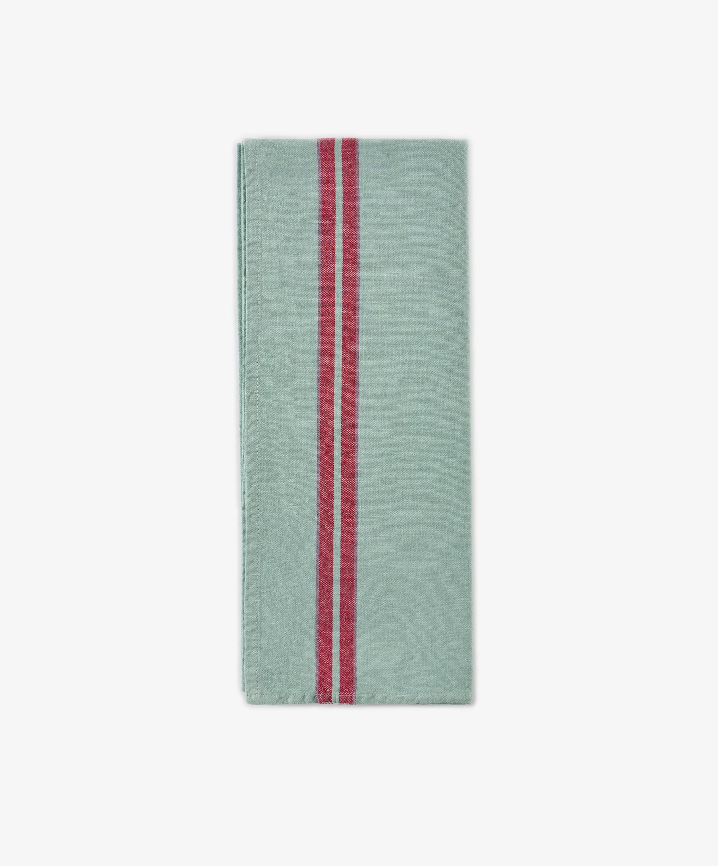 A folded light green Métis Tea Towel with two parallel red vintage stripes running vertically near the left edge, reminiscent of classic French kitchen linens, displayed on a plain white background.