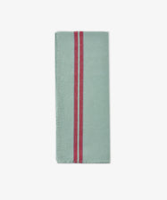 A folded light green Métis Tea Towel with two parallel red vintage stripes running vertically near the left edge, reminiscent of classic French kitchen linens, displayed on a plain white background.