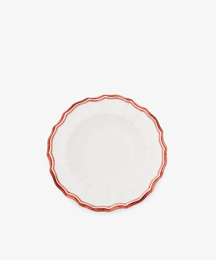 The Eva Melamine Bowl, Set of 4, features a white finish, scalloped edges, and a red-brown wavy border inspired by Italian practicality, photographed on a plain white background.