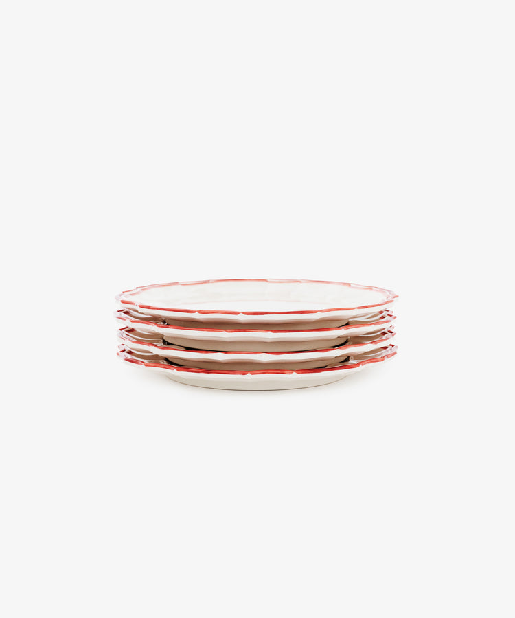 Set of four Eva Melamine Small Plates with wavy red rims, crafted in a classic style from BPA-free melamine—durable and perfect for everyday use.