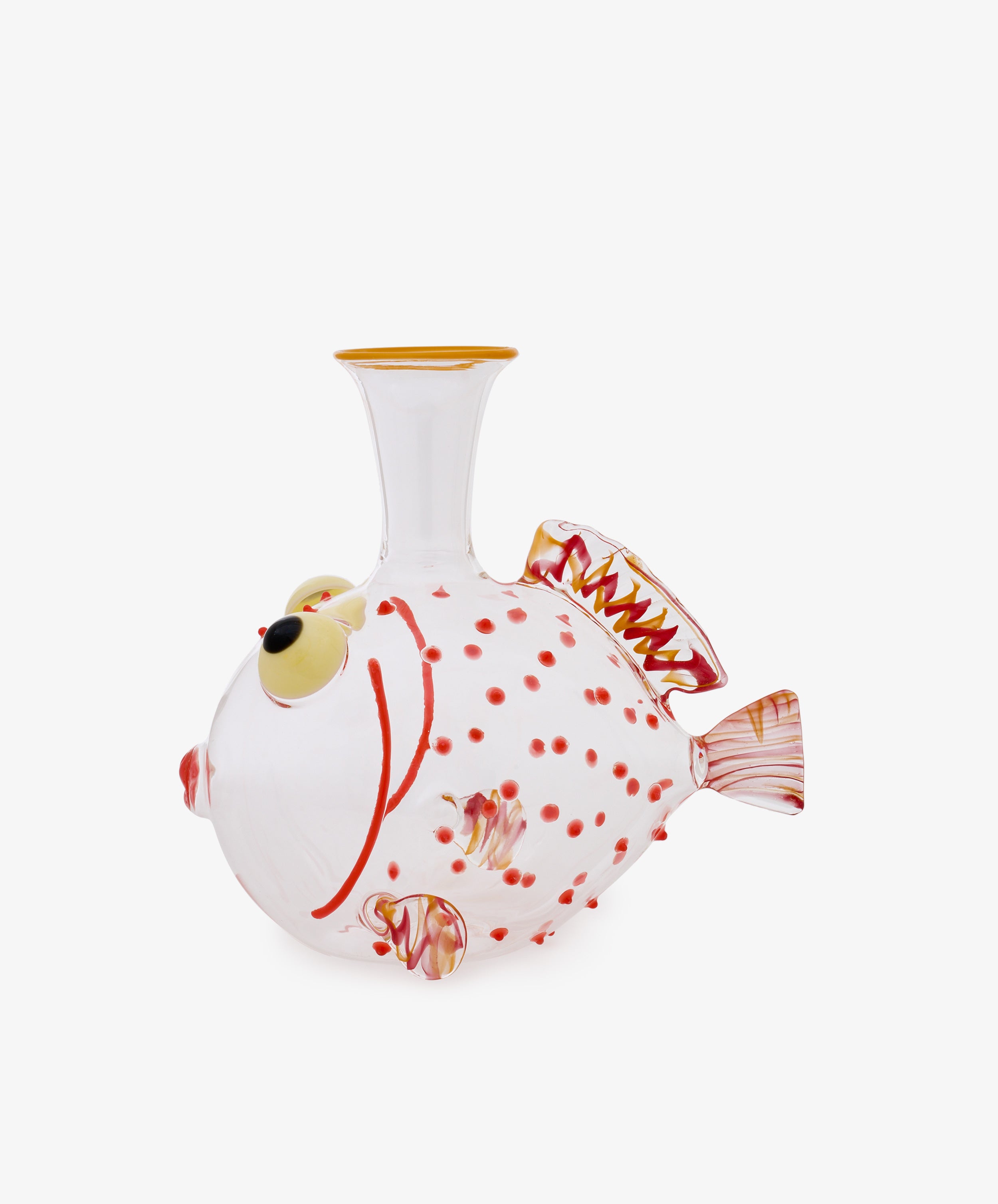 The Guppy Decanter, crafted from clear Murano glass in the shape of a fish, features red spots, yellow accents, and intricately detailed fins in Massimo Lunardon’s signature style, presented against a plain white background.