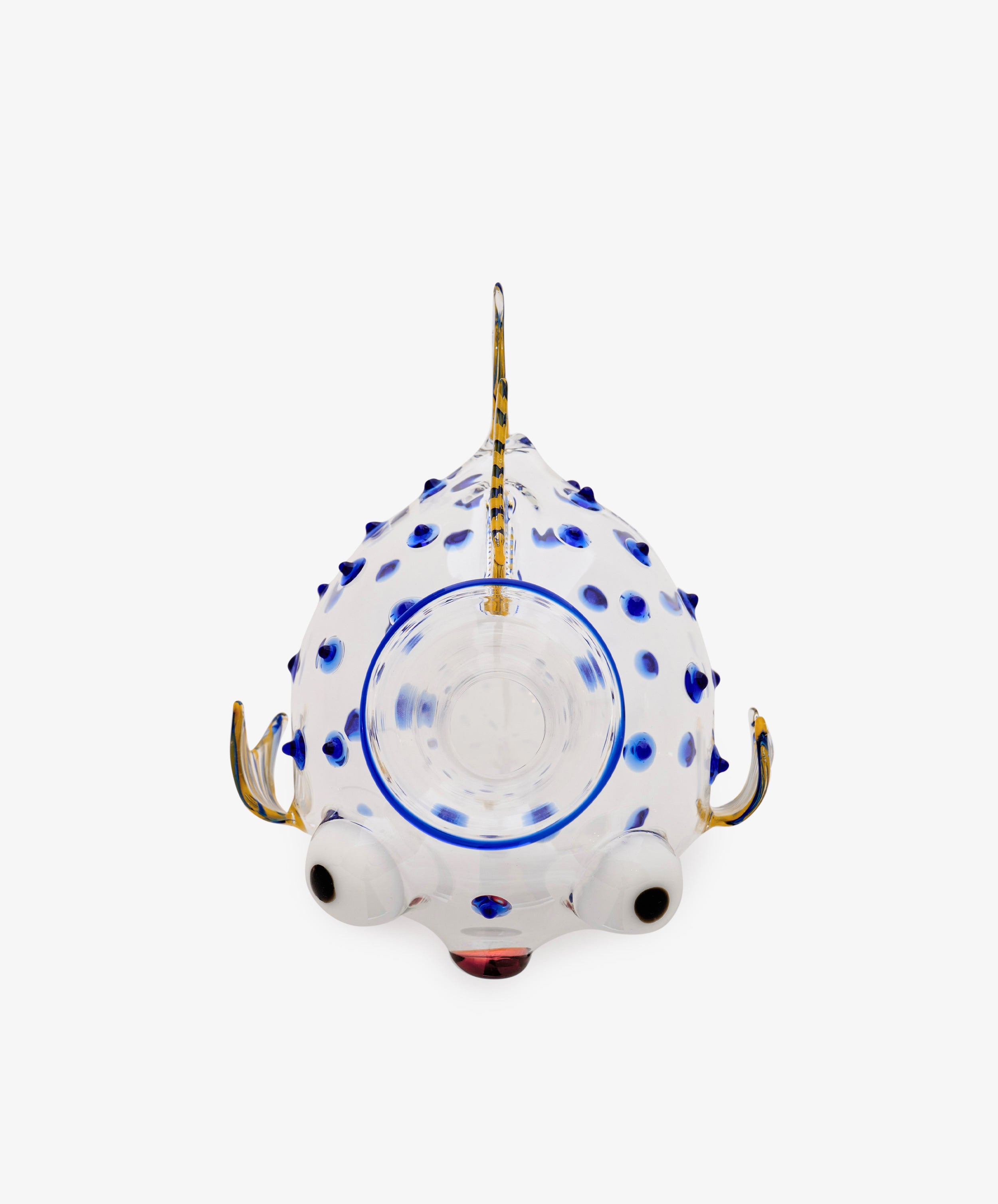 Pappagallo Decanter—a whimsical glass teapot shaped like a fish, featuring cobalt blue glass spots, large eyes, and a gold-colored handle, spout, and fin, viewed from above against a white background; reminiscent of Massimo Lunardon’s playful Murano glass designs.
