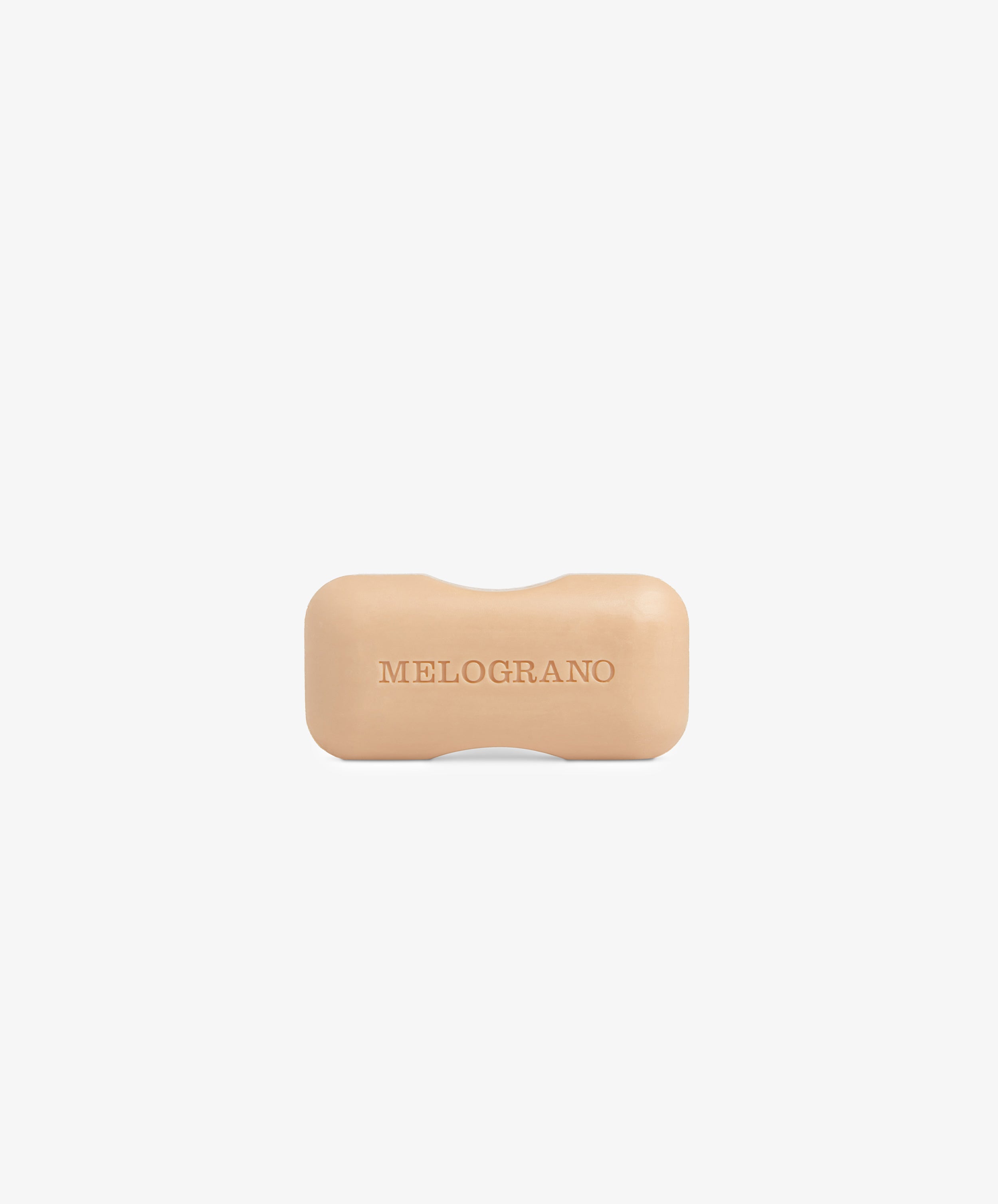 The Melograno Soap, a beige rectangular bar from Santa Maria Novella with rounded edges and embossed lettering, is displayed against a plain white background.