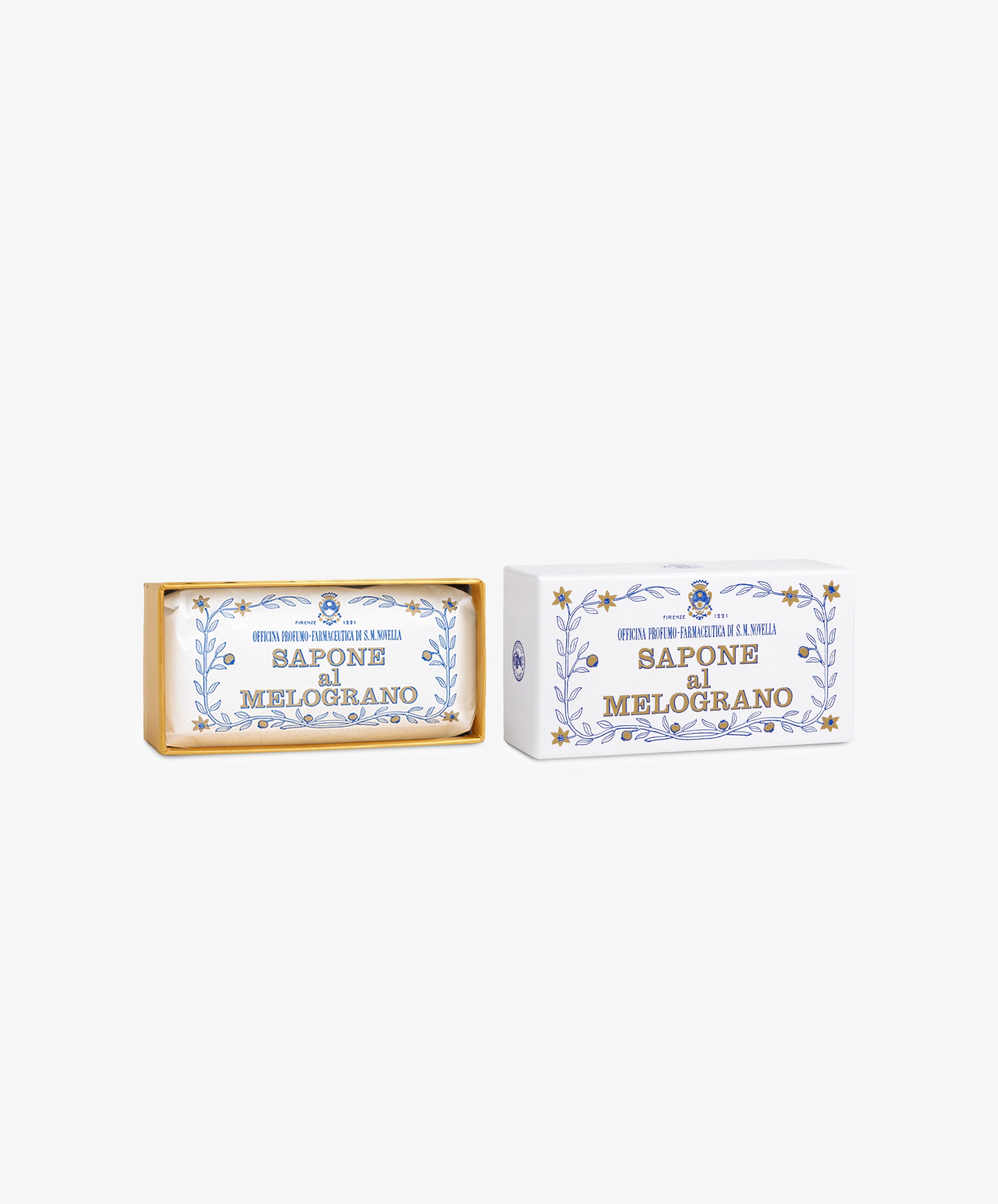 A bar of Melograno Soap rests beside its ornate white and gold packaging with Italian labels, highlighting the refined tradition of Italian soap.