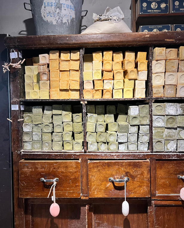 stacked soaps in wooden dresser