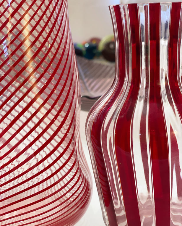 close up of clear and red striped glass