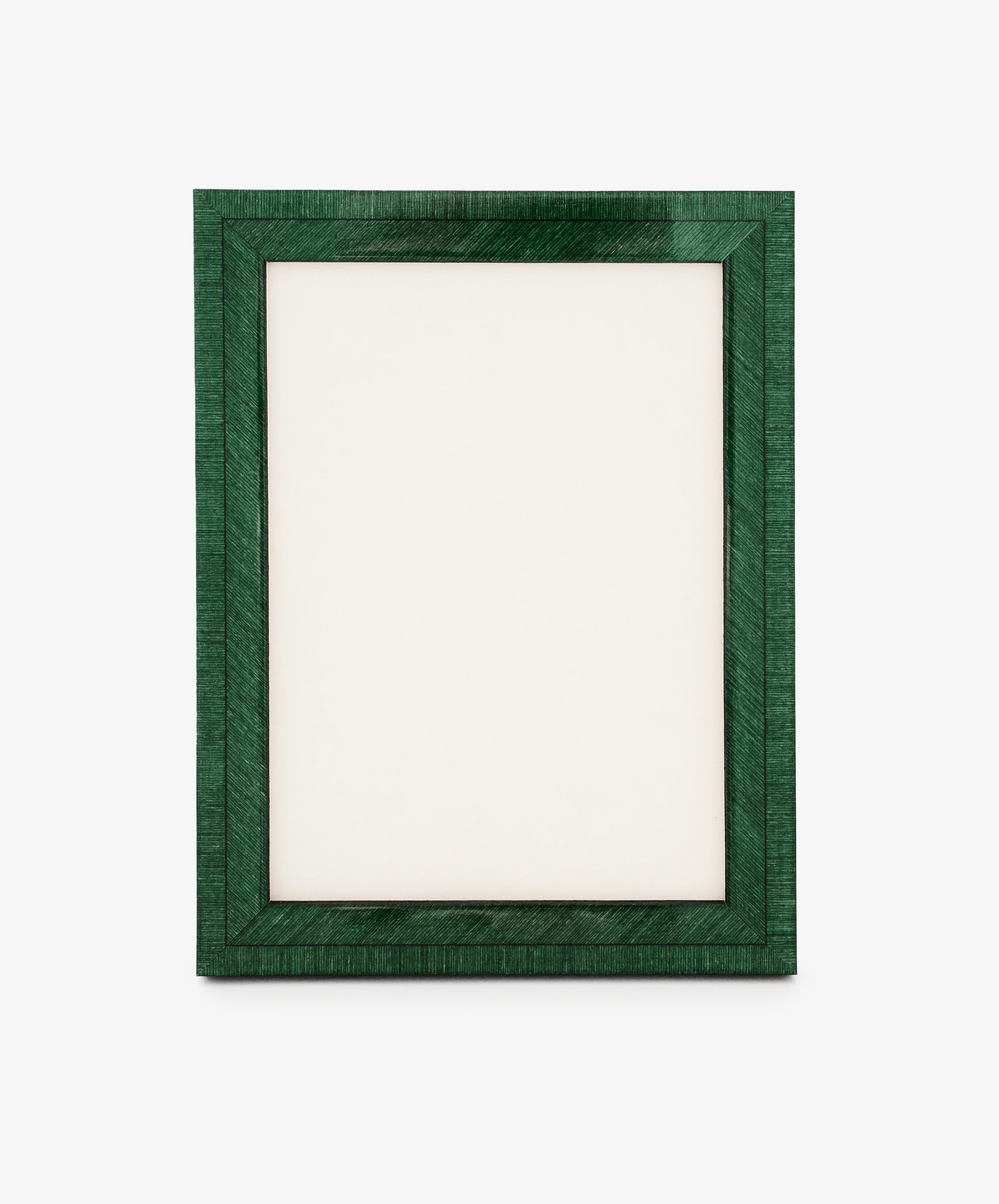 The Torino Frame is a rectangular, dark green wood frame standing upright with a blank white center on a plain background, showcasing precision craftsmanship through its clean lines and balanced proportions.