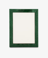 The Torino Frame is a rectangular, dark green wood frame standing upright with a blank white center on a plain background, showcasing precision craftsmanship through its clean lines and balanced proportions.
