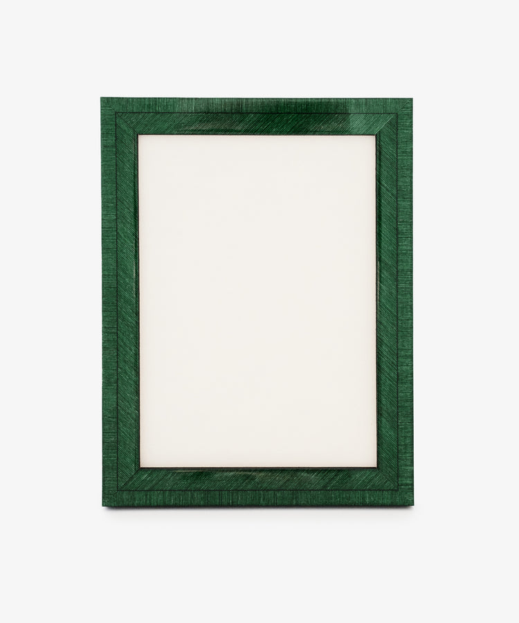 The Torino Frame is a rectangular, dark green wood frame standing upright with a blank white center on a plain background, showcasing precision craftsmanship through its clean lines and balanced proportions.