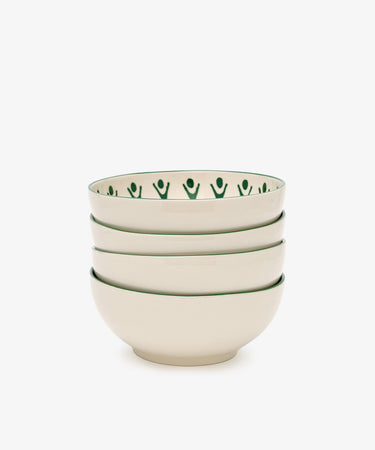 The Vito Cereal Bowl, Set of 4, includes cream ceramic bowls with a green rim and abstract green pattern—handmade tableware ideal for everyday use.