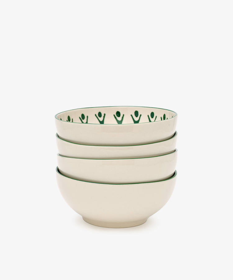 The Vito Cereal Bowl, Set of 4, includes cream ceramic bowls with a green rim and abstract green pattern—handmade tableware ideal for everyday use.
