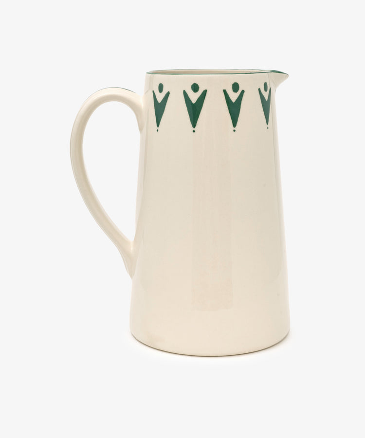 The Vito Jug is a white ceramic jug with a handle, highlighted by a row of green geometric designs near the rim—an eye-catching addition for fans of distinctive glassware.