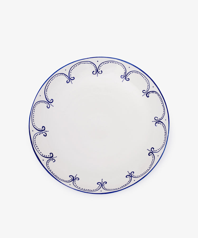 The Arco Serving Platter is a white ceramic Portuguese piece featuring a blue decorative rim, displayed on a plain white background.
