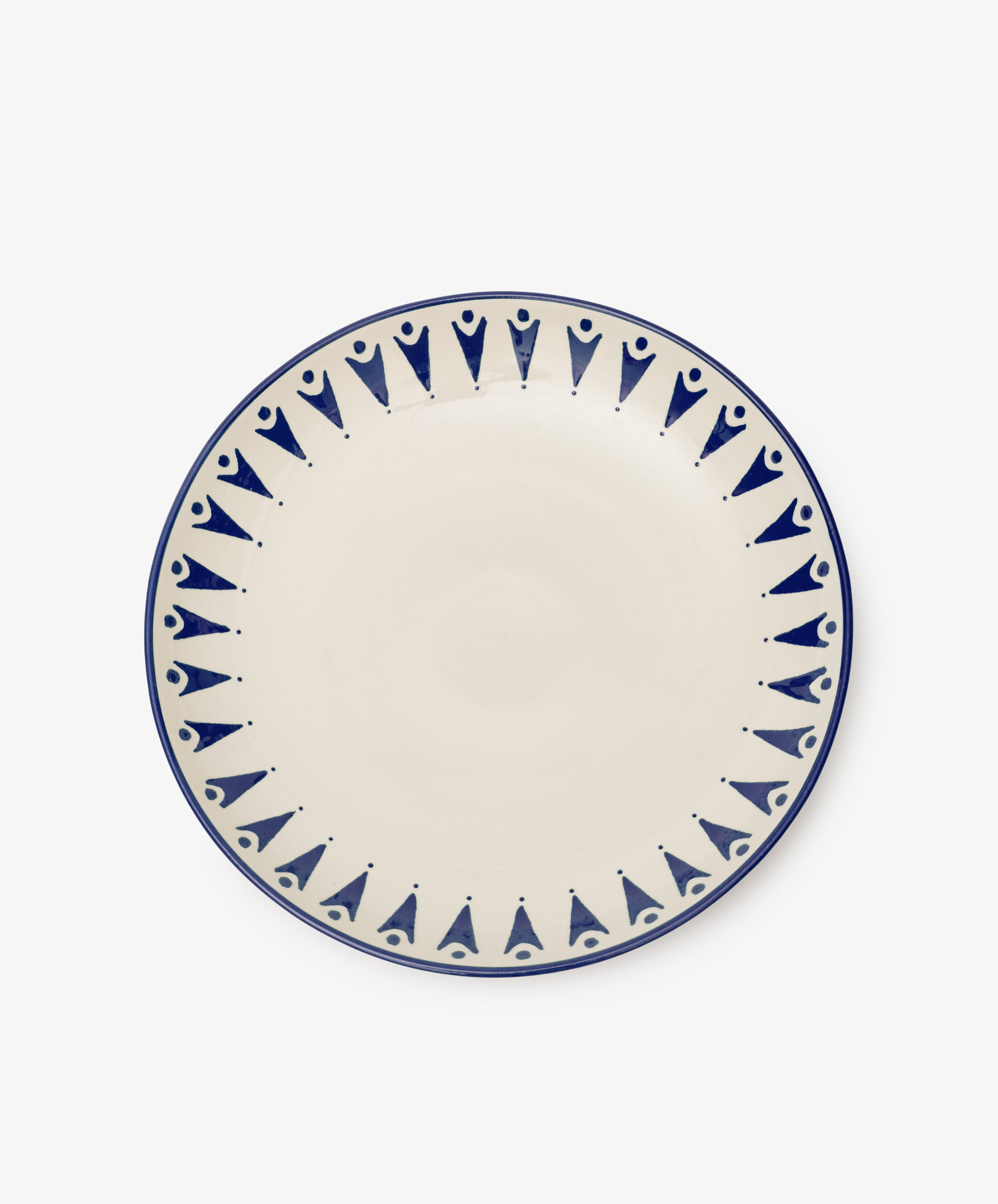 The Vito Serving Platter is a round ceramic piece with a cream center and blue geometric rim, showcasing understated handmade style.