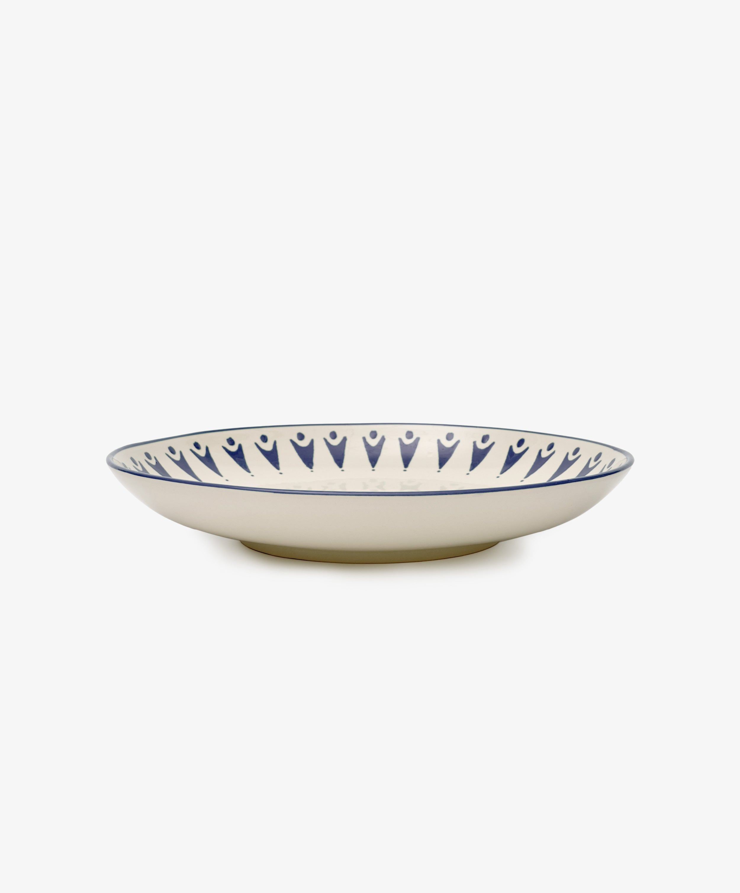 The Vito Serving Platter features a cream base with a blue geometric rim, offering understated style and photographed on a white background.