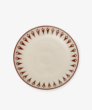 The Vito Serving Platter is a round ceramic piece with a cream center and a border of repeating red geometric patterns—perfect handmade serveware for any table setting.