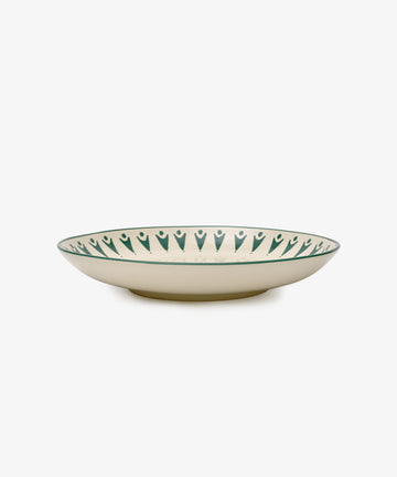 The Vito Serving Platter is a shallow, round ceramic piece with a cream base and a dark green geometric rim—handmade serveware thats perfect as a unique gift for any occasion.