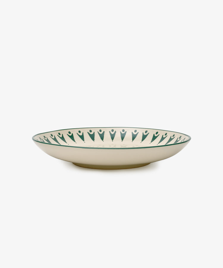 The Vito Serving Platter is a shallow, round ceramic piece with a cream base and a dark green geometric rim—handmade serveware thats perfect as a unique gift for any occasion.
