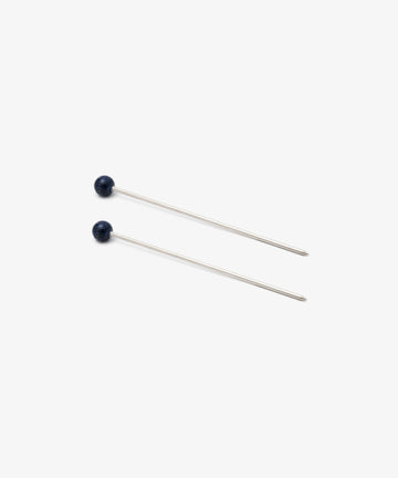 The Ella Cocktail Sticks, Set of 2, features two straight metal pins with small round blue stone heads, arranged parallel on a plain white background.