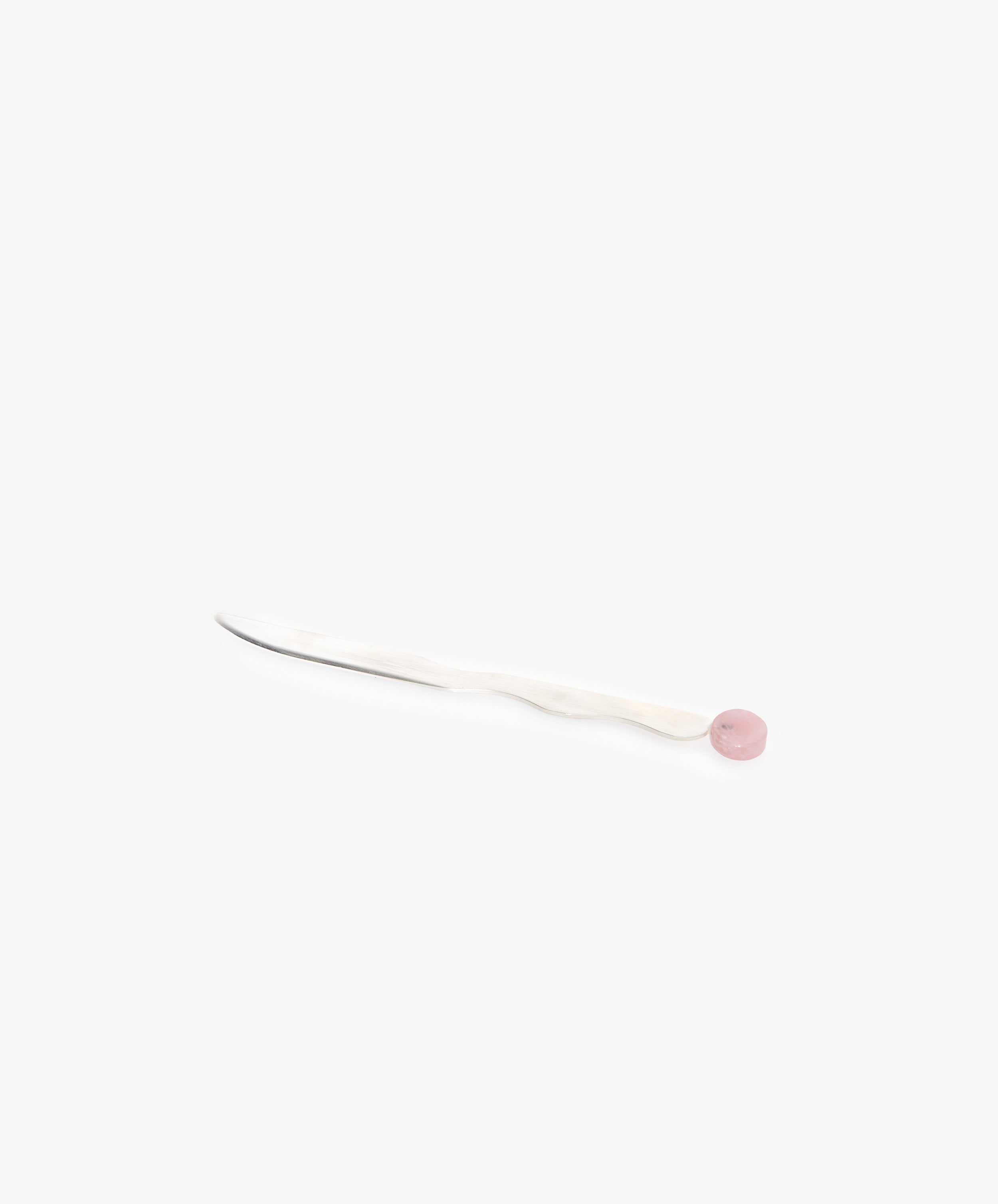 The Letter Opener features a silver-plated blade, twisted white handle, and pink round end—a designer desk accessory shown on a plain white background.