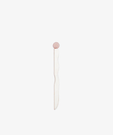 A minimalist, handcrafted Letter Opener with a wavy white and silver-plated blade and a round pink quartz-inspired handle, showcased against a plain white background.