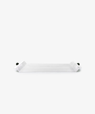 The Roberta Serving Tray is rectangular and white with upturned ends and small round dark side knobs, featuring a minimal design against a plain white background.