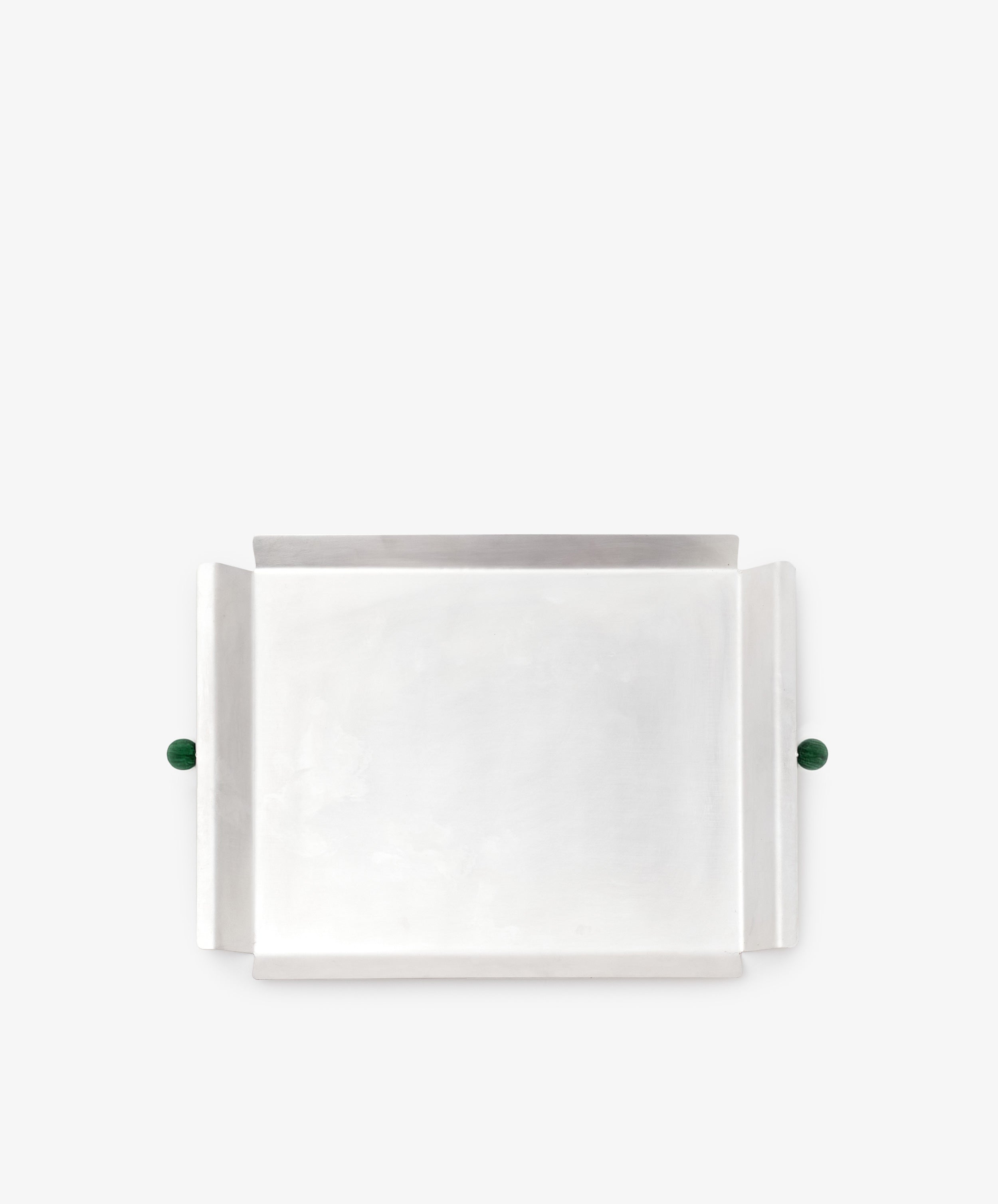 The Freya Serving Tray features a rectangular silver design, raised sides, and two green stone handles—a unique home decor piece shown on a plain white background.