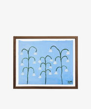 Framed painting titled Snow Drops shows white bell-shaped flowers with green stems on a light blue background; artist NM’s initials at lower right. Part of Nancy McKie’s Field Studies, featured in PORTA’s Art360 collection.