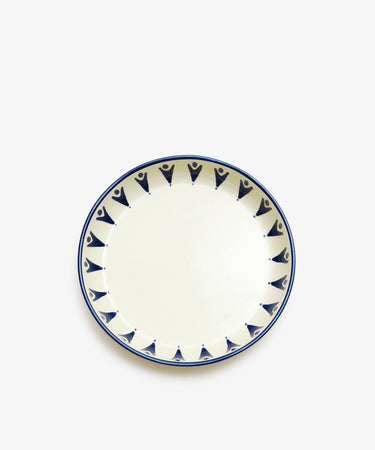 Vito Pasta Bowl. White stoneware shallow bowl with painted blue rim and design details.