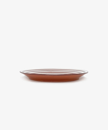 The Natalia Platter is a handmade, shallow, round brown ceramic plate with a smooth surface, shown against a plain white background.