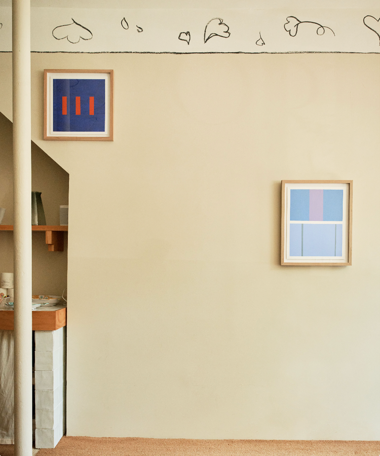 Magnetic Color Field Paintings framed in wood and hung on tan colored wall.